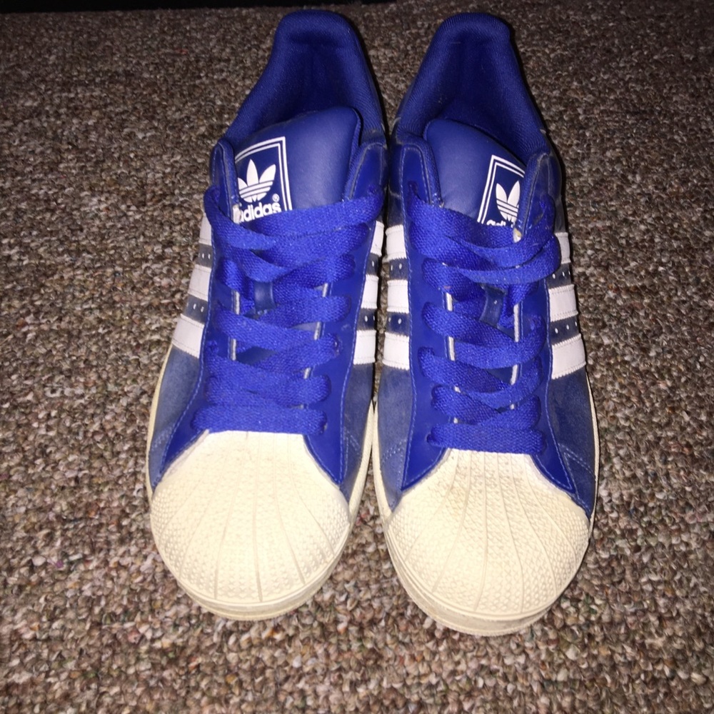 Adidas blue faded to white shell top.